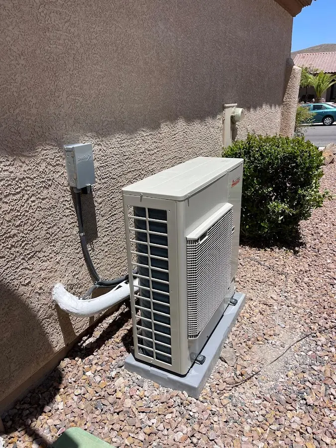 Residential air conditioning condenser unit in Springville